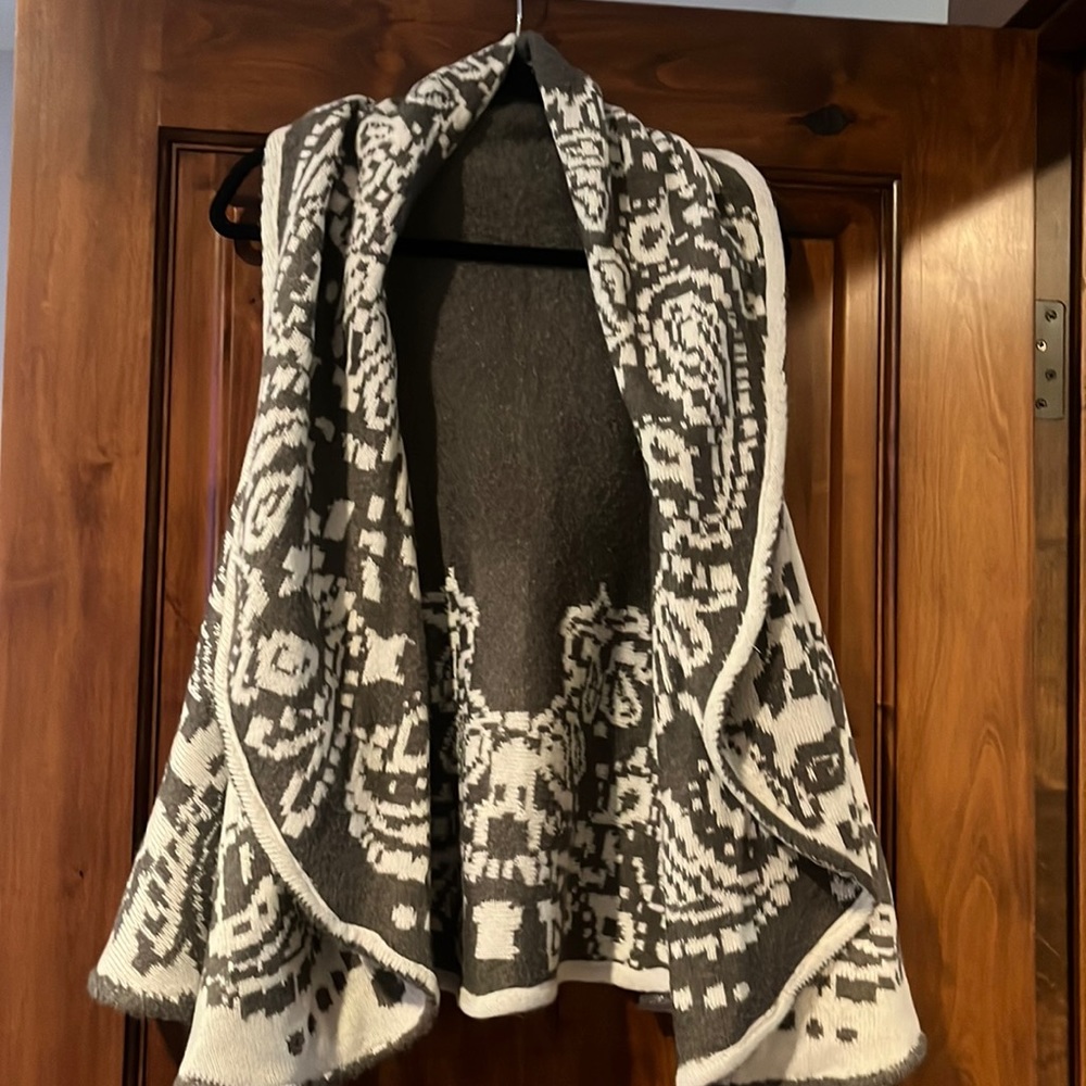 Gray and off white reversible sweater vest.